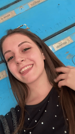 Selfie session by a blue mailbox wall in Burgas