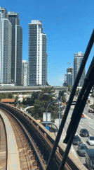 Train journey through Burnaby-Coquitlam corridor on sunny afternoon