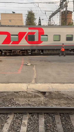 Train passenger documents rail journey through Krasnodar countryside