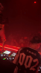 DJ and chandelier-headdress performer light up North Kuta club