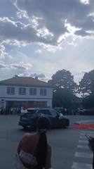 Community gathering with decorated vehicle in Bulgarian village