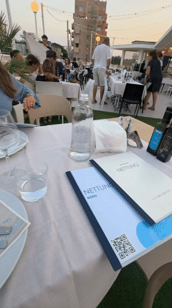 Outdoor dining moment at a Rimini restaurant table