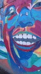 Street murals span bold color, weathered walls, and abstract imagery