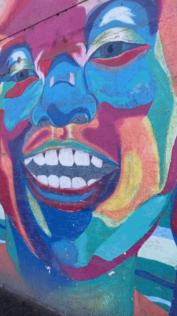 Street murals span bold color, weathered walls, and abstract imagery