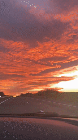 Dramatic sunset illuminates Zheleznik sky in orange and red