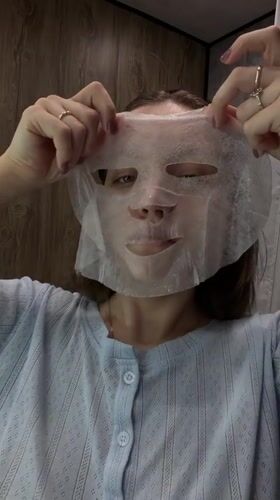 Woman performs morning skincare routine in Reshetnikovo, Russia