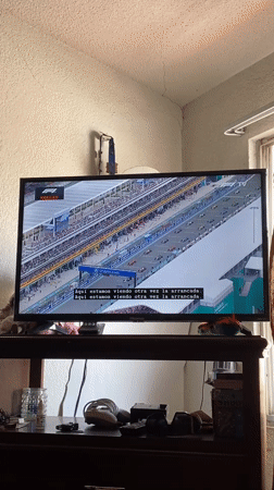 Mexican resident watches F1 replay while cooking at home