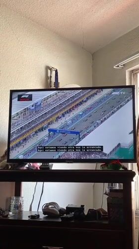Mexican resident watches F1 replay while cooking at home