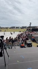 Camera crews document outdoor concert setup at San Isidro venue
