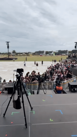Camera crews document outdoor concert setup at San Isidro venue