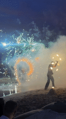 Fire performers entertain beachgoers in Thailand nighttime show