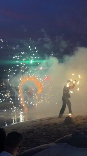 Fire performers entertain beachgoers in Thailand nighttime show