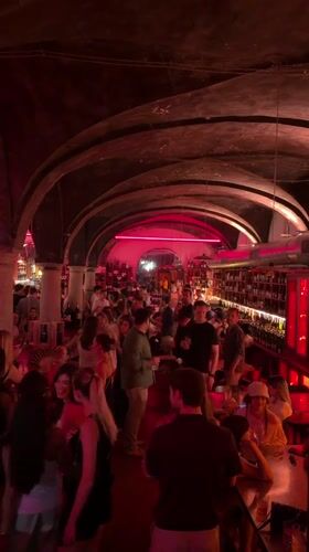 Milan nightlife: neon-lit bars and a DJ set