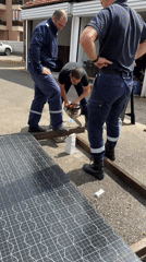 Workers cut wooden beam with chainsaw in Kazanlak