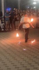 Fire performers light up Anapa's promenade on a summer night