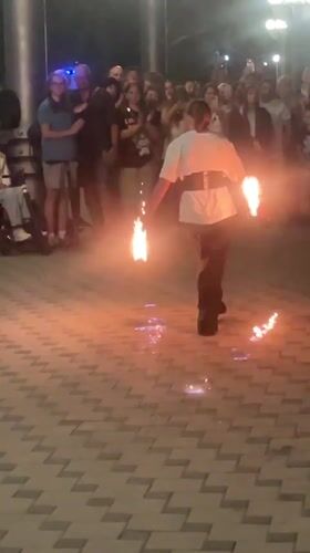 Fire performers light up Anapa's promenade on a summer night