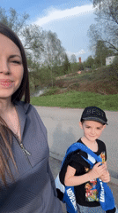 Woman and child enjoy afternoon at Shevlyakovo park playground