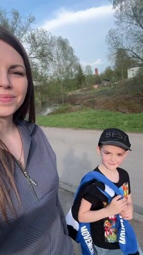 Woman and child enjoy afternoon at Shevlyakovo park playground