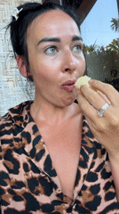 Woman in leopard print relaxes outdoors in Bali