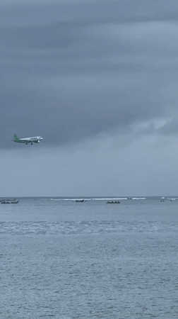 Rainy evening beach life documented in Kuta Selatan
