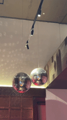 Man enjoys hot dogs at disco-lit cafe in Izhevsk