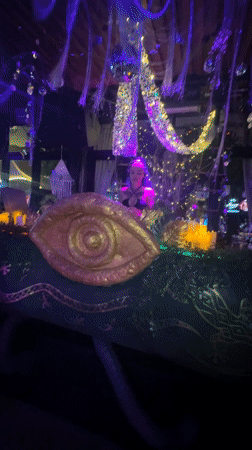 Nightclub event with DJ and purple-lit beachside area in Thailand