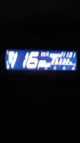 Here is a concise description of the video:

The video shows a digital speedometer in a vehicle. The speed increases from 16 to 17 km/h. The lighting conditions are dark. The background is black. There is a sudden noise at the beginning of the video.