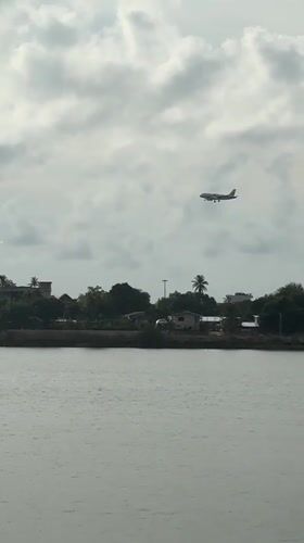 Thailand coastal communities witness plane landing, rainbow amid storms