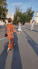 Outdoor concert draws a crowd in a sunny city square
