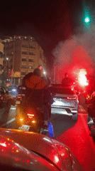 Motorcyclists celebrate with red flares on Marrakesh streets