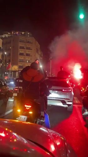 Motorcyclists celebrate with red flares on Marrakesh streets