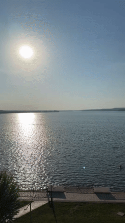 Sunny day captured at Votkinsk waterway with bright reflections