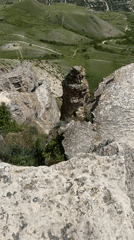 Rocky cliff landscape with valley view captured on video