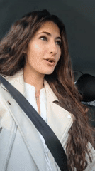 Woman singing in car during traffic jam early morning