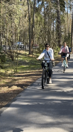 Four cyclists ride through wooded path in Zelenogorsk