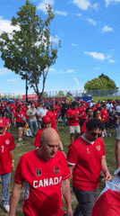 Canada soccer fans gather in red shirts in Toronto