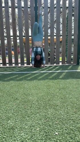 Two women prepare for pull-up workout at Kiryat Bialik park