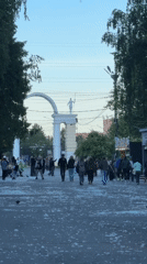 Girl skateboarding, painting near Izhevsk memorial draws casual observers