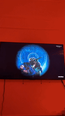 Coachella Live broadcast shows hooded rapper performing under blue spotlight
