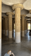 Tourists explore Barcelona's Gaudí landmarks during morning hours