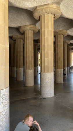 Tourists explore Barcelona's Gaudí landmarks during morning hours