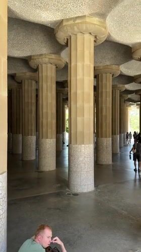 Tourists explore Barcelona's Gaudí landmarks during morning hours
