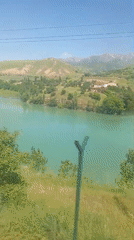 Traveler captures scenic lake and hillside views in Uzbekistan