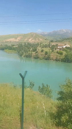 Traveler captures scenic lake and hillside views in Uzbekistan