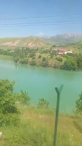 Traveler captures scenic lake and hillside views in Uzbekistan