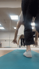 Woman performs handstand in Ramat Gan dance studio