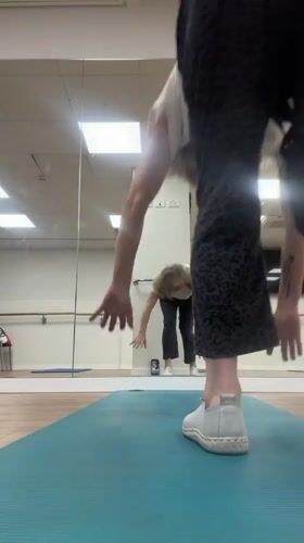 Woman performs handstand in Ramat Gan dance studio