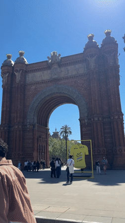 Sunny day at Barcelona's Arc de Triomf draws pedestrians
