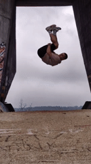 Man performs acrobatic routine near graffitied structure in Varna