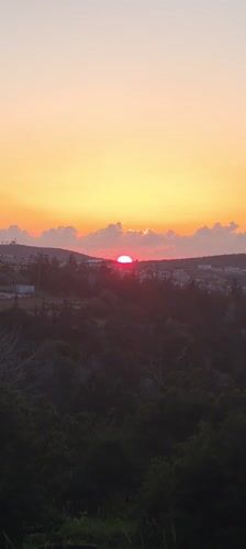 Vibrant red sunset captured over Lachish Regional Council, Israel
